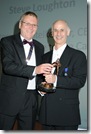 Mick Shaddock handing Steve Loughton his award at the CESA conference